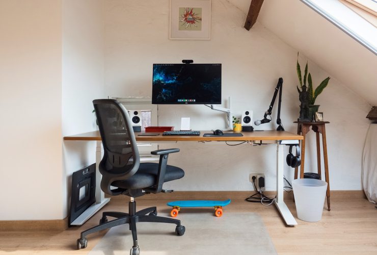 a desk with a computer on top of it