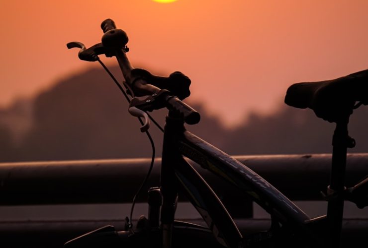 black bicycle during golden hour